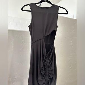 Divided black dress with midriff cutout in front